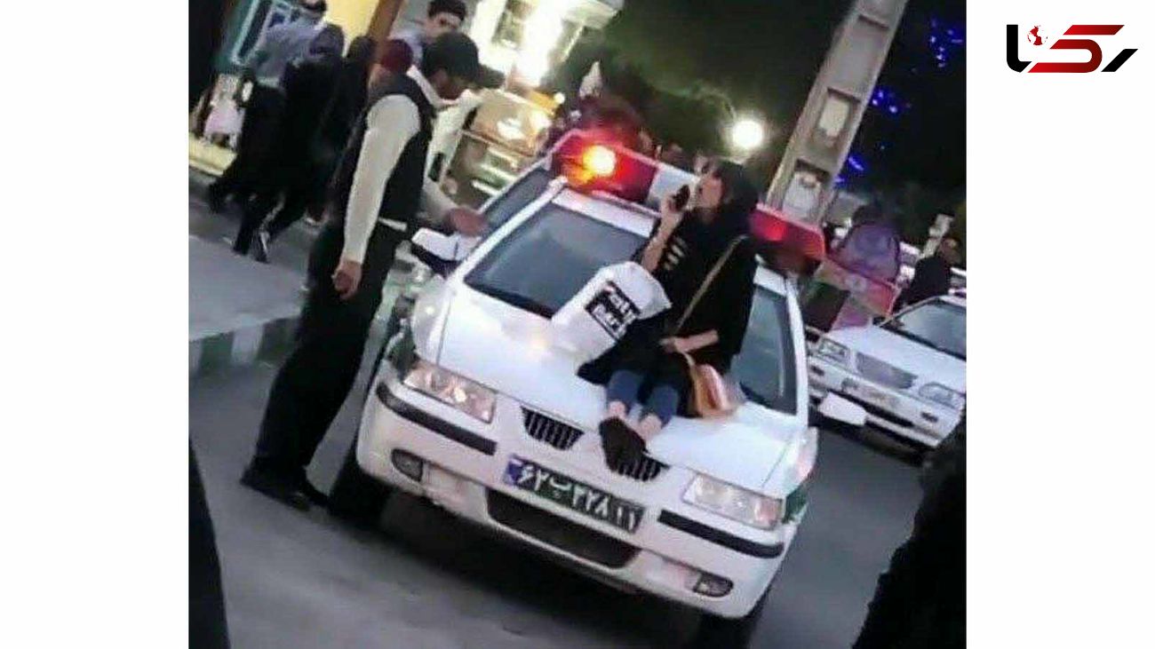 عکس دختر بدحجاب که روی ماشین پلیس نشست او در آذربایجان غربی بازداشت شد